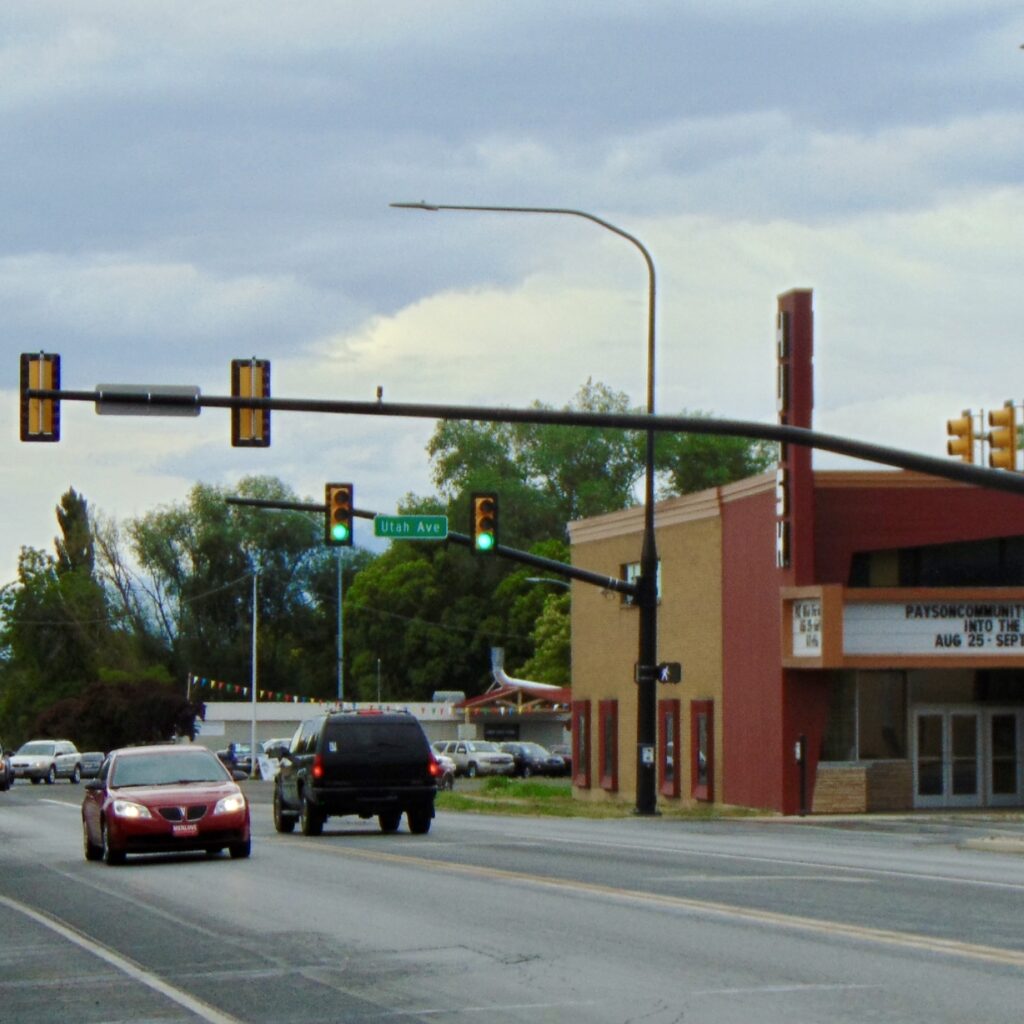 Downtown Payson Utah street view with cars, traffic lights, and the historic theater building for Payson Water Damage Restoration