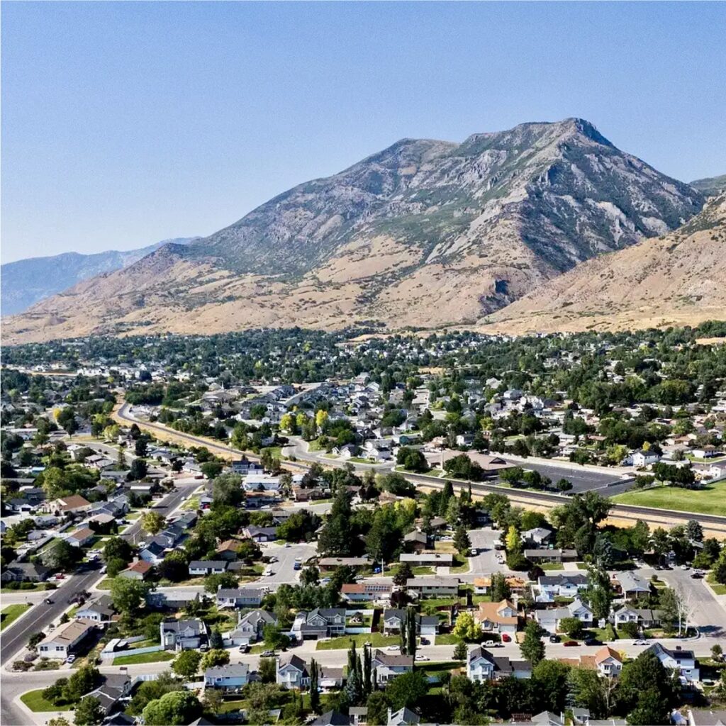 Aerial view of Lindon Utah neighborhood with homes, roads, and mountains in the background for Lindon Water Damage Restoration